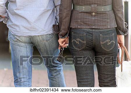 "Rear view, couple standing side by side, Grevenbroich, North Rhine-Westphalia, Germany, Europe" View Large Photo Image Picture - "Rear view, couple standing side by side, Grevenbroich, North Rhine-Westphalia, Germany, Europe". Fotosearch