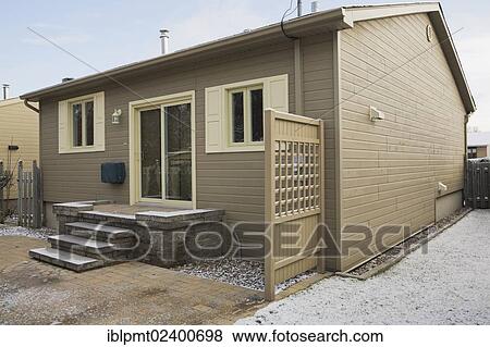 "Rear view of a Residential bungalow and backyard in winter, Quebec, Canada, North America" View Large Photo Image Stock Photo - "Rear view of a Residential bungalow and backyard in winter, Quebec, Canada, North America". Fotosearch