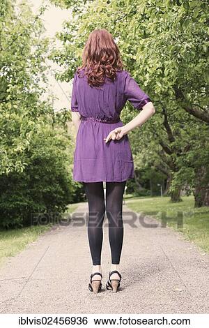 Rear view of woman with fingers crossed behind her back View Large Photo Image Stock Photograph - Rear view of woman with fingers crossed behind her back. Fotosearch