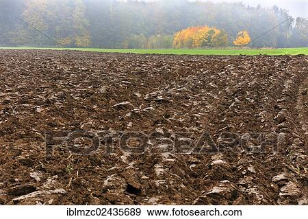 "Recently ploughed field in a hazy autumn landscape, Enzenreuth, Franconian Switzerland, Middle Franconia, Bavaria, Germany, Europe" View Large Photo Image Stock Photo - "Recently ploughed field in a hazy autumn landscape, Enzenreuth, Franconian Switzerland, Middle Franconia, Bavaria, Germany, Europe". Fotosearch