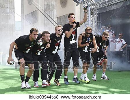 Stock Photo - "Reception of the German national team after their victory at the FIFA World Cup 2014, fan party at the Brandenburg Gate, Berlin, Germany, Europe". Fotosearch