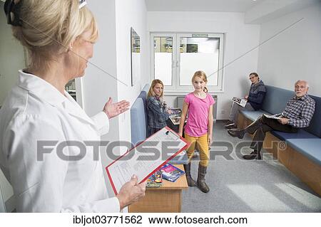 "Receptionist calling for the next patient in the waiting room of a dental office, Germany, Europe" View Large Photo Image Stock Image - "Receptionist calling for the next patient in the waiting room of a dental office, Germany, Europe". Fotosearch