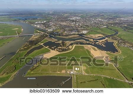Stock Photo - "Reconstruction of the Lippe River joining the Rhine River, port of Wesel, restoration, aerial view, Wesel, North Rhine-Westphalia, Germany, Europe". Fotosearch