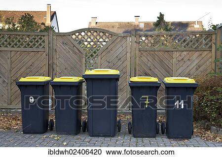 Stock Image - "Recycling bins standing on the side of the road, Kamen, Ruhr area, North Rhine-Westphalia, Germany, Europe, PublicGround, Europe". Fotosearch