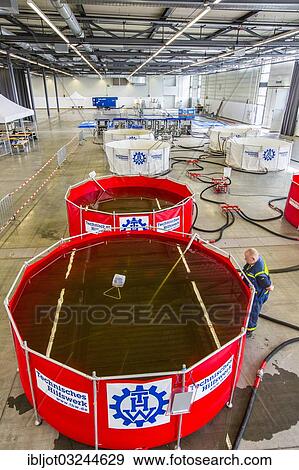 "Recycling tanks, drinking water treatment plant of the THW, Federal Agency for Technical Relief, TWAA UF-15, mobile water supply system for use in the event of a disaster, MŸnster, North Rhine-Westphalia, Germany, Europe" View Large Photo Image Stock Photo - "Recycling tanks, drinking water treatment plant of the THW, Federal Agency for Technical Relief, TWAA UF-15, mobile water supply system for use in the event of a disaster, MŸnster, North Rhine-Westphalia, Germany, Europe". Fotosearch