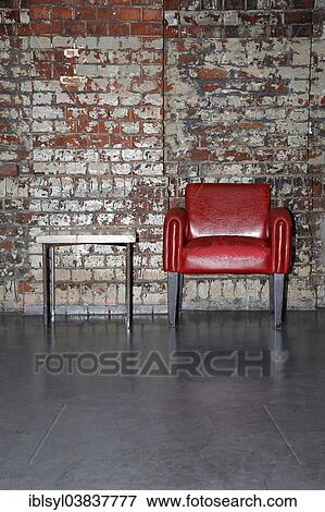 "Red armchair in front of an old brick wall, Tanzhaus NRW, dance theatre, Dusseldorf, North Rhine-Westphalia, Germany, Europe" View Large Photo Image Stock Photo - "Red armchair in front of an old brick wall, Tanzhaus NRW, dance theatre, Dusseldorf, North Rhine-Westphalia, Germany, Europe". Fotosearch