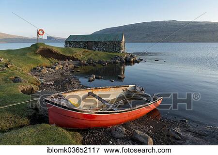 "Red boat in front of a boat house on Lake Sorvagsvatn or Leitisvatn, Vagar, Faroe Islands, Denmark, Europe" View Large Photo Image Stock Photo - "Red boat in front of a boat house on Lake Sorvagsvatn or Leitisvatn, Vagar, Faroe Islands, Denmark, Europe". Fotosearch