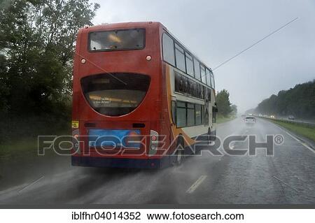 "Red bus in the rain on the highway, Cornwall, England, United Kingdom, Europe" View Large Photo Image Stock Image - "Red bus in the rain on the highway, Cornwall, England, United Kingdom, Europe". Fotosearch