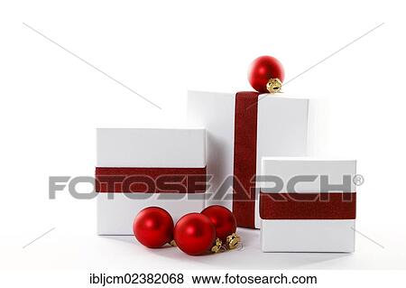 Stock Photo - Red Christmas baubles and presents with red ribbons. Fotosearch