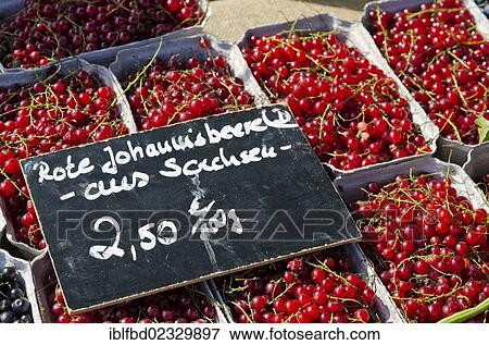 Stock Photo - "Red currants with price tag for sale at the weekly market, Dresden, Saxony, Germany, Europe". Fotosearch