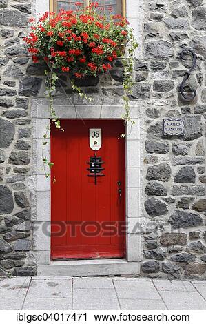 Stock Image - "Red door, Rue du Petit-Champlain, Quebec, Quebec Province, Canada, North America". Fotosearch