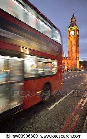 Stock Image - "Red double-decker bus in front of Elizabeth Tower or Big Ben at dusk, London, England, United Kingdom, Europe". Fotosearch