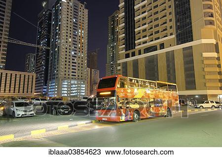 "Red double decker tour bus, at night, Sharjah, Emirate of Sharjah, United Arab Emirates, Asia" View Large Photo Image Stock Image - "Red double decker tour bus, at night, Sharjah, Emirate of Sharjah, United Arab Emirates, Asia". Fotosearch