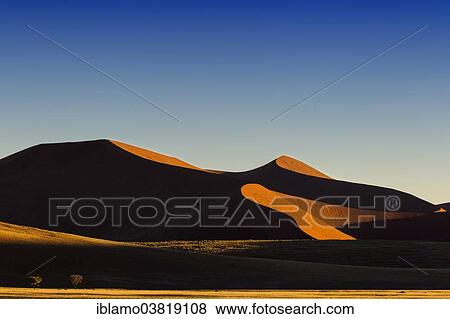 Stock Photo - "Red dunes, black shadow, Namib Naukluft National Park, Namibia, Africa". Fotosearch