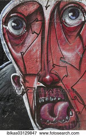 "Red face with an open mouth, graffiti, Meiderich, Duisburg, Ruhr district, North Rhine-Westphalia, Germany, Europe" View Large Photo Image Stock Photo - "Red face with an open mouth, graffiti, Meiderich, Duisburg, Ruhr district, North Rhine-Westphalia, Germany, Europe". Fotosearch