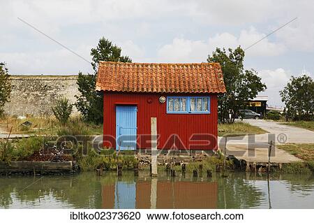 "Red fisherman's cottage in Le Chateau d'Oleron, Ile d? ÆOleron island, Poitou-Charentes region, departement of Charente-Maritime, France, Europe" View Large Photo Image Stock Image - "Red fisherman's cottage in Le Chateau d'Oleron, Ile d? ÆOleron island, Poitou-Charentes region, departement of Charente-Maritime, France, Europe". Fotosearch