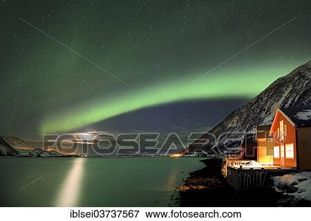 "Red fishing huts on the fjord in winter with Northern Lights, Sommeroya, Tromso, ‪Troms, Northern Norway, Norway, Europe" View Large Photo Image Stock Photo - "Red fishing huts on the fjord in winter with Northern Lights, Sommeroya, Tromso, ‪Troms, Northern Norway, Norway, Europe". Fotosearch