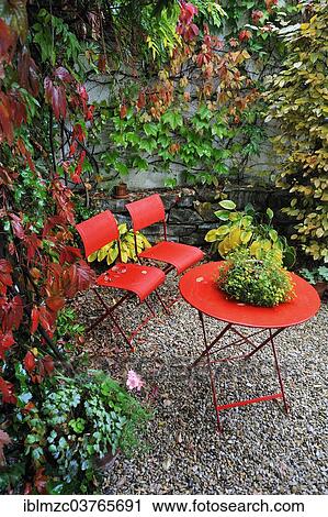 "Red garden chairs and table in the rain in an autumn garden corner, Middle Franconia, Bavaria, Germany, Europe" View Large Photo Image Stock Image - "Red garden chairs and table in the rain in an autumn garden corner, Middle Franconia, Bavaria, Germany, Europe". Fotosearch