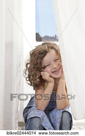"Red-haired girl, 5 years old, sitting and smiling on the stairs of a balcony" View Large Photo Image Picture - "Red-haired girl, 5 years old, sitting and smiling on the stairs of a balcony". Fotosearch