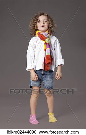 "Red-haired girl, 5 years old, wearing a scarf and jeans" View Large Photo Image Stock Image - "Red-haired girl, 5 years old, wearing a scarf and jeans". Fotosearch