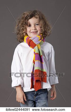 "Red-haired girl, 5 years old, wearing a scarf and jeans" View Large Photo Image Stock Image - "Red-haired girl, 5 years old, wearing a scarf and jeans". Fotosearch