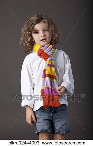 "Red-haired girl, 5 years old, wearing a scarf and jeans" View Large Photo Image Stock Image - "Red-haired girl, 5 years old, wearing a scarf and jeans". Fotosearch