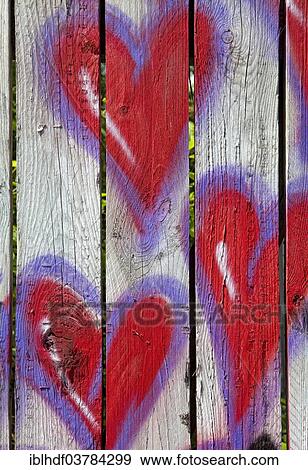 "Red hearts on a fence, graffiti, Germany, Europe" View Large Photo Image Stock Photo - "Red hearts on a fence, graffiti, Germany, Europe". Fotosearch
