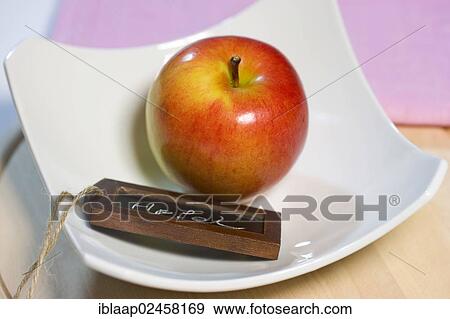Stock Photo - "Red organic apple with chalk board """"Apfel"""", German for """"Apple""""". Fotosearch