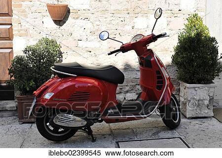 "Red scooter parked in the historic centre of Assisi, Italy, Europe" View Large Photo Image Stock Photography - "Red scooter parked in the historic centre of Assisi, Italy, Europe". Fotosearch
