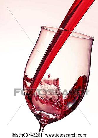Red wine being poured into a glass View Large Photo Image Stock Image - Red wine being poured into a glass. Fotosearch