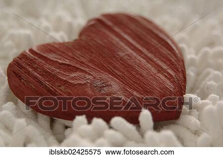 Red wooden heart on a white shag View Large Photo Image Stock Photography - Red wooden heart on a white shag. Fotosearch