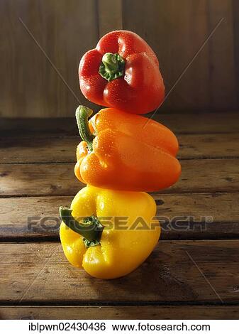 Stock Photograph - "Red, yellow and orange fresh peppers". Fotosearch