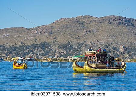 "Reed boats near the floating islands of the Uros on Lake Titicaca, Puno, Peru, South America" View Large Photo Image Stock Photo - "Reed boats near the floating islands of the Uros on Lake Titicaca, Puno, Peru, South America". Fotosearch