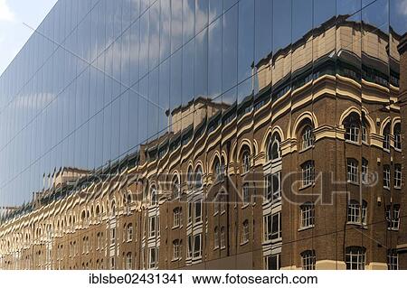 Stock Image - "Reflection in a mirrored facade in Battle Bridge Lane, London, England, United Kingdom, Europe". Fotosearch