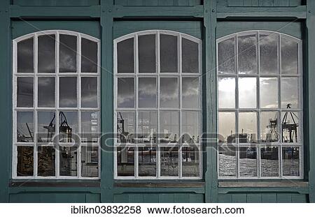 "Reflection of a harbour scene in an old boat shed, Ovelgonne, Hamburg, Germany, Europe" View Large Photo Image Stock Photo - "Reflection of a harbour scene in an old boat shed, Ovelgonne, Hamburg, Germany, Europe". Fotosearch