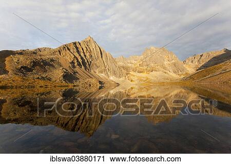 "Reflection of Mount Monolith in calm Grizzly Lake, Tombstone Mountains Territorial Park, Yukon Territory, Canada, North America" View Large Photo Image Stock Image - "Reflection of Mount Monolith in calm Grizzly Lake, Tombstone Mountains Territorial Park, Yukon Territory, Canada, North America". Fotosearch