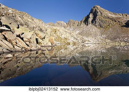 Reflection of Rinnenspitze Mountain in Lake Rinnensee, Stubai Alps, Tyrol, Austria, Europe View Large Photo Image Stock Image - Reflection of Rinnenspitze Mountain in Lake Rinnensee, Stubai Alps, Tyrol, Austria, Europe. Fotosearch