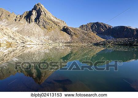 Reflection of Rinnenspitze Mountain in Lake Rinnensee, Stubai Alps, Tyrol, Austria, Europe View Large Photo Image Stock Image - Reflection of Rinnenspitze Mountain in Lake Rinnensee, Stubai Alps, Tyrol, Austria, Europe. Fotosearch