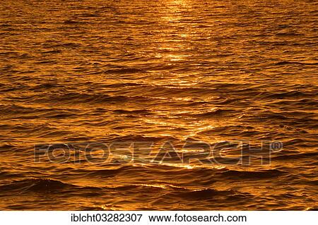 "Reflections on the water surface at sunset, Sanibel Island, Florida, United States, North America" View Large Photo Image Stock Photo - "Reflections on the water surface at sunset, Sanibel Island, Florida, United States, North America". Fotosearch
