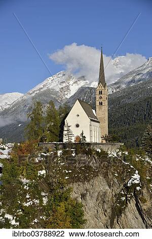 "Reformed Church of St. George in front of mountains, Scuol, Lower Engadine, Canton of Grisons, Switzerland, Europe" View Large Photo Image Stock Image - "Reformed Church of St. George in front of mountains, Scuol, Lower Engadine, Canton of Grisons, Switzerland, Europe". Fotosearch