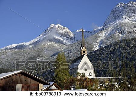 "Reformed Church of St. George in front of mountains, Scuol, Lower Engadine, Canton of Grisons, Switzerland, Europe" View Large Photo Image Stock Photo - "Reformed Church of St. George in front of mountains, Scuol, Lower Engadine, Canton of Grisons, Switzerland, Europe". Fotosearch