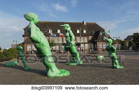 "Reisende im Wind sculptural group on the station forecourt of Westerland, Sylt, Schleswig-Holstein, Germany, Europe" View Large Photo Image Stock Photo - "Reisende im Wind sculptural group on the station forecourt of Westerland, Sylt, Schleswig-Holstein, Germany, Europe". Fotosearch