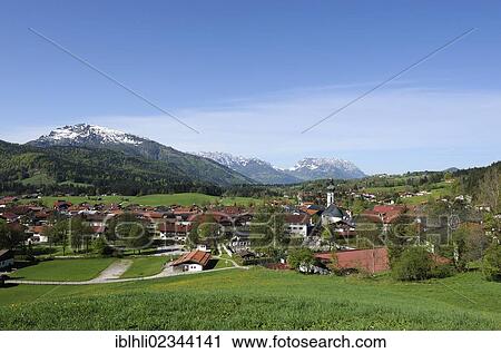 Stock Image - "Reit im Winkl with Unterberg mountain, Wilder Kaiser mountain and Zahmer Kaiser mountain, Chiemgau, Upper Bavaria, Bavaria, Germany, Europe". Fotosearch