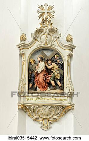 Stock Image - "Relief image of the fifth station in the Stations of the Cross, Simon helping Jesus carry the cross, Cathedral of St. Salvator, Fulda, Hesse, Germany, Europe". Fotosearch