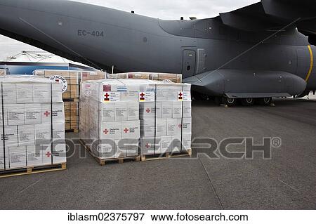 "Relief supplies, hygiene packages, German Red Cross, ready to be loaded onto an Airbus A400M, ILA 2012, Berlin, ExpoCenter Airport, Brandenburg, Germany, Europe" View Large Photo Image Stock Photo - "Relief supplies, hygiene packages, German Red Cross, ready to be loaded onto an Airbus A400M, ILA 2012, Berlin, ExpoCenter Airport, Brandenburg, Germany, Europe". Fotosearch