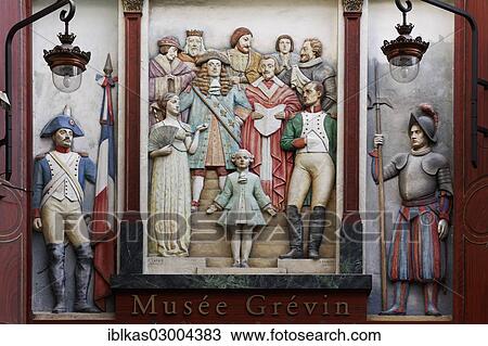 Stock Image - "Relief with historical figures, entrance to Musee Grevin waxwork museum, Passage Jouffroy, 9th Arrondissement, Paris, Ile-de-France, France, Europe". Fotosearch