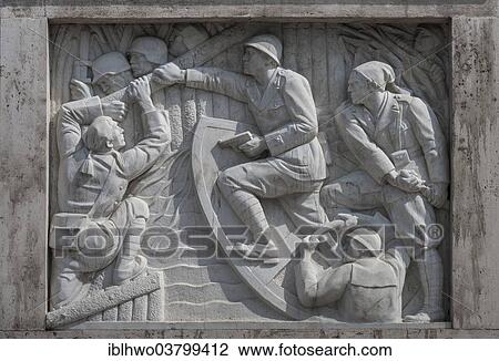 Stock Image - "Relief with war representations of the fascists, on the Duca d'Aosta bridge over the Tiber River, 1939 to 1942, access to the Foro Italico, formerly Foro Mussolini, Rome, Lazio, Italy, Europe". Fotosearch
