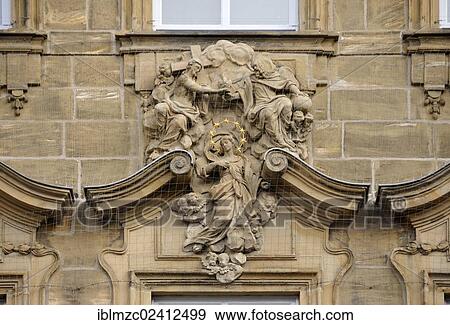 Stock Photo - Religious relief on a facade, Am Grunen Markt, Bamberg, Upper Franconia, Bavaria, Germany, Europe, PublicGround, Europe. Fotosearch
