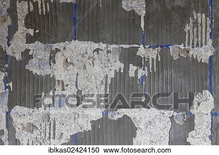 Stock Image - Removed tiles, old bathroom, bathroom renovation. Fotosearch