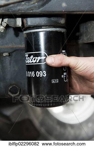 "Removing oil filter from tractor engine block, England, United Kingdom, Europe" View Large Photo Image Stock Image - "Removing oil filter from tractor engine block, England, United Kingdom, Europe". Fotosearch